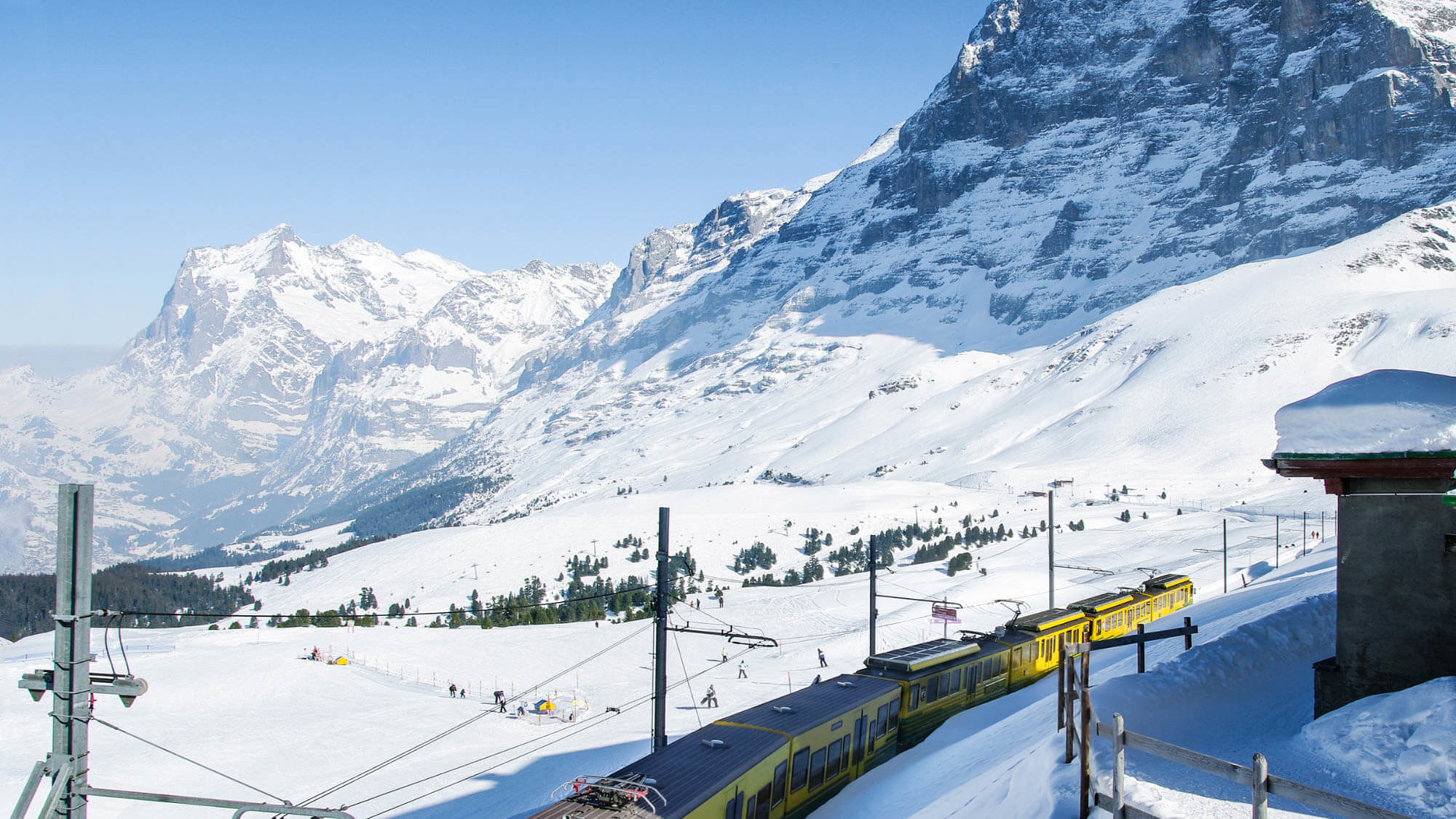 Train passing through the snow in the Swiss Alps