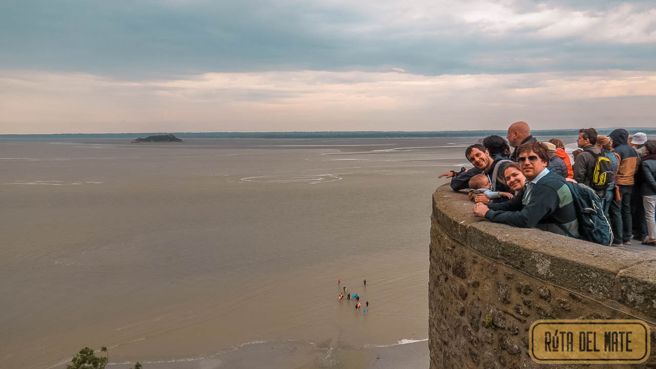 The tide rises at Mont Saint-Michel, seen from the village. Nico (Flor’s brother), Euge (sister-in-law), Juan, and Benja watching.